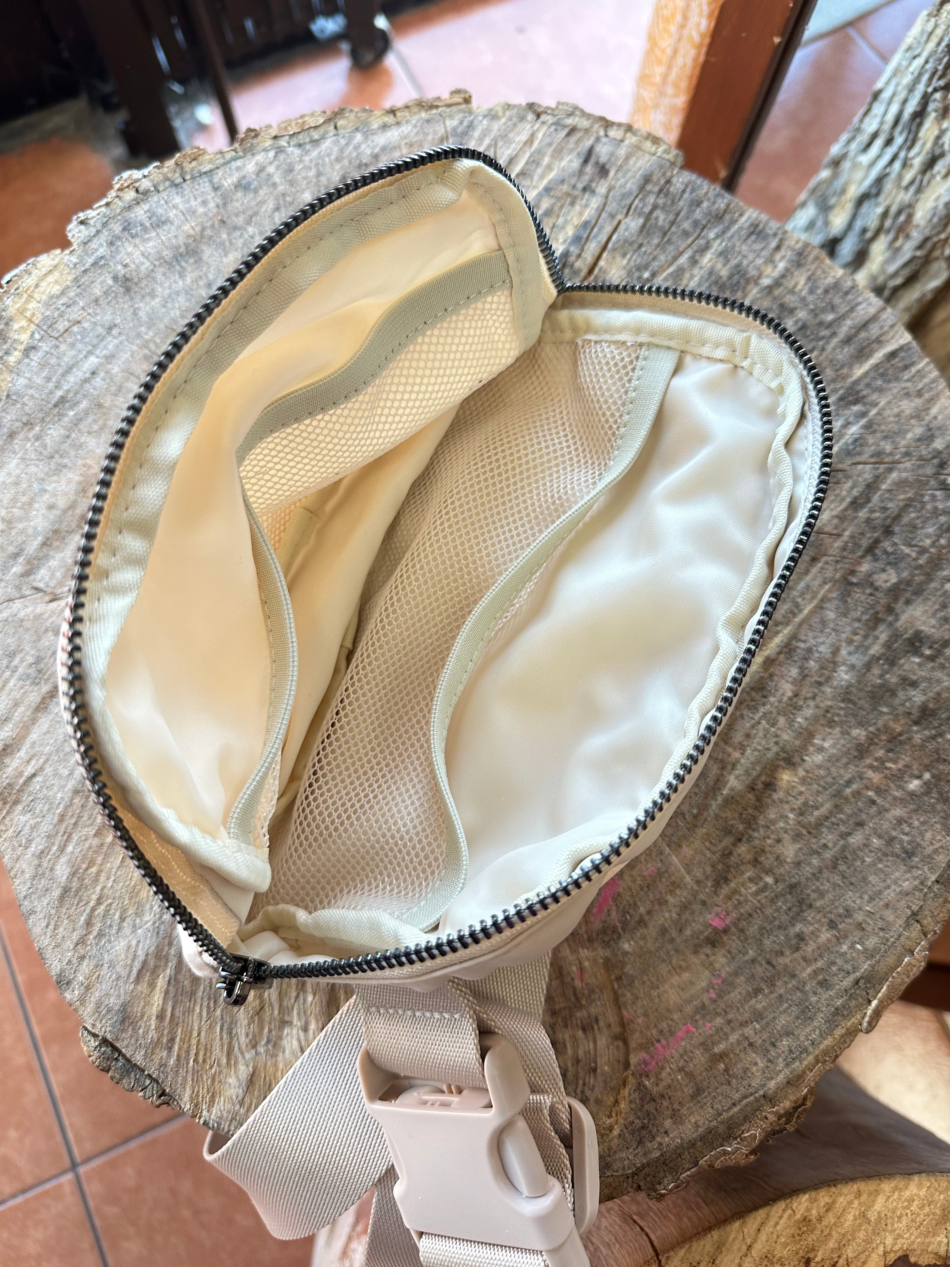Out and about belt bag cream